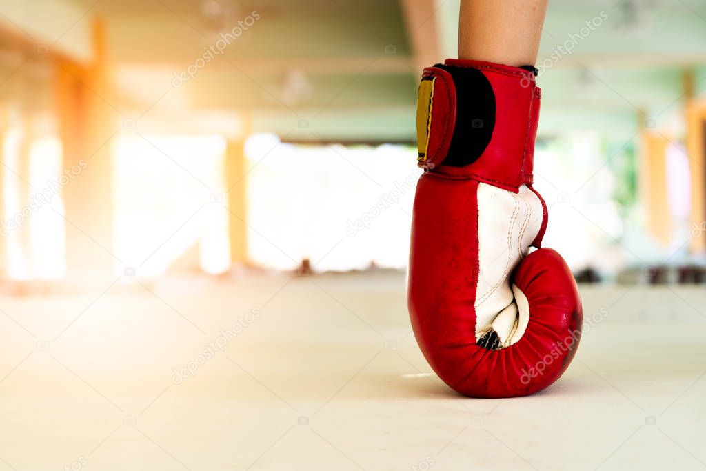 old red boxing gloves knock out the ground