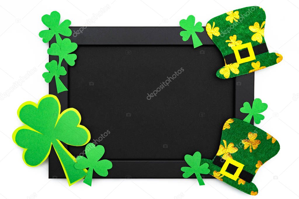St Patricks day, festive leprechaun hat and green Shamrocks on the photo frame