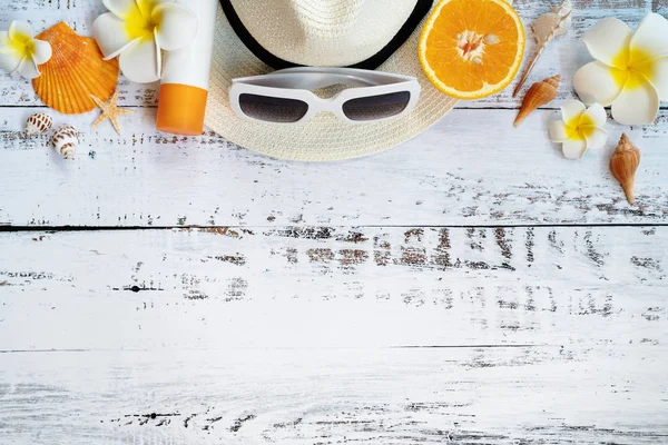 Beautiful summer holiday, Beach accessories, orange, sunglasses, hat and shells on wooden backgrounds — Stock Photo, Image
