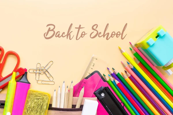 Welcome back to school background, colorful color pencil and stationery bag on yellow backgrounds with copy space — Stock Photo, Image