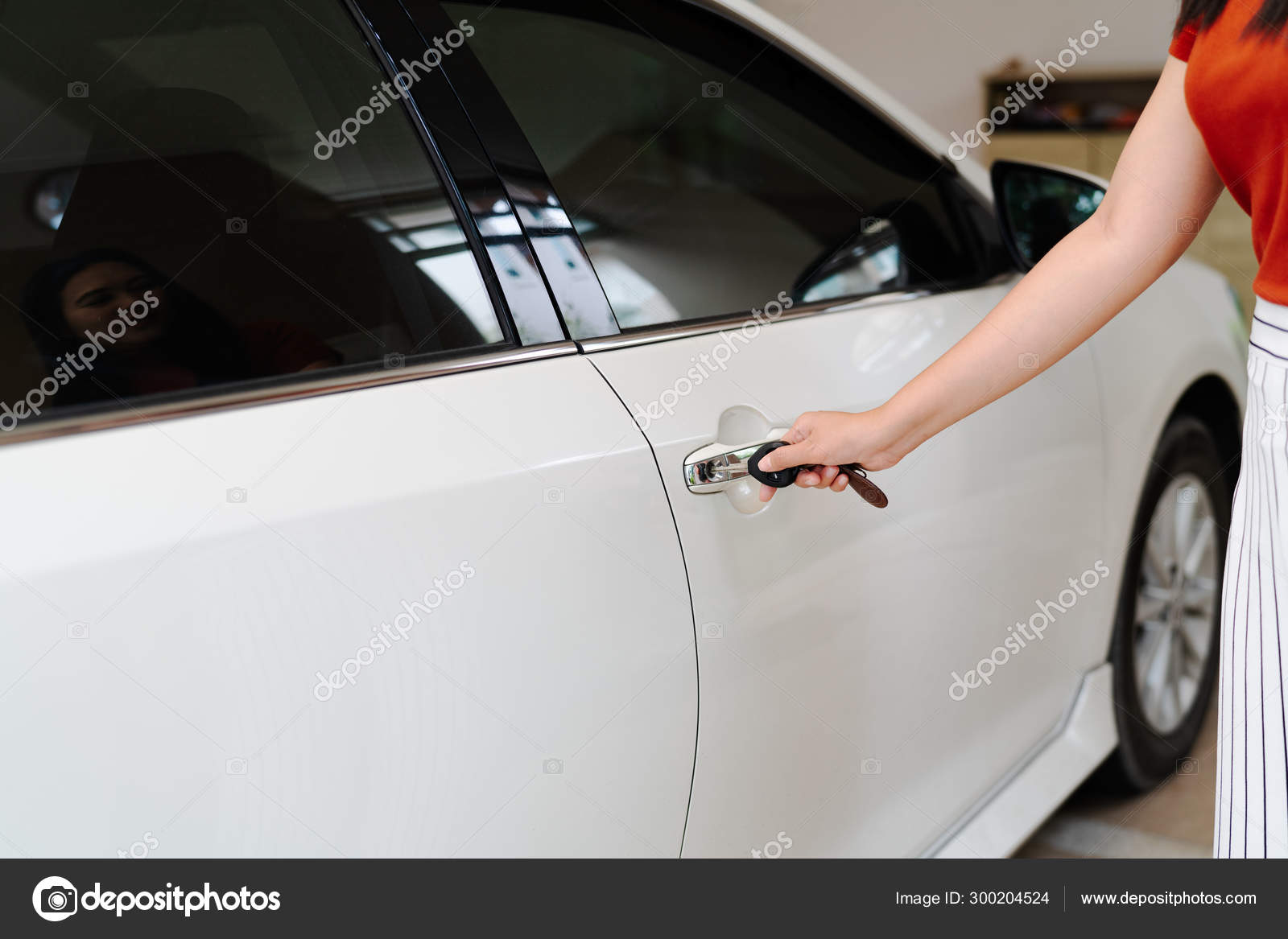 Car Unlocks Woman Use Key To Open The Car Door Stock Photo