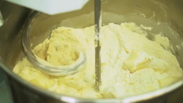 Mixing a dough for bread baking with professional kneader spiral machine at the manufacturing. Production of cookies — Stock Video