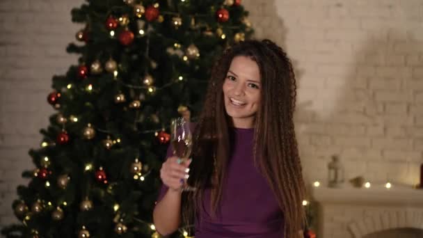 Girl with a glass of champagne congratulates the new year — Stock Video