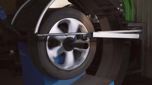 Car wheel balancing in tire service.