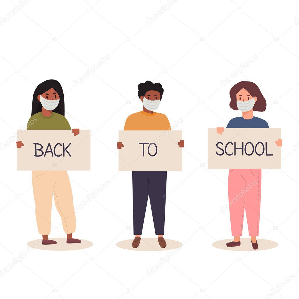 Back to school after pandemia concept. Diversity of children schoolboys and schoolgirls of different ethnicities standing together holding placard. Trendy teenagers wearing face mask with banners