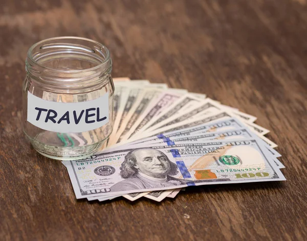 Travel budget concept. Travel money savings in glass jar