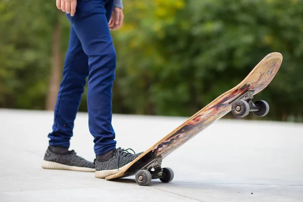 Longboard girl on street at beautiful summer evening, long board. Lifestyle concept