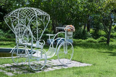 White bicycles in the back garden.