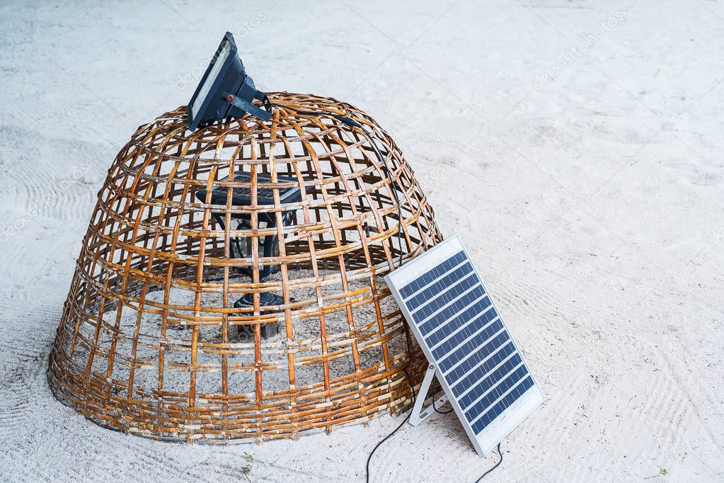 Mini stand electric solar cell in a beach
