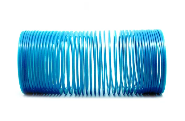 Niebieski Slinky Zabawki Białym Tle Białym Tle — Zdjęcie stockowe