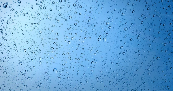 Σταγόνες Βροχής Φόντο Μπλε Γυάλινο Παράθυρο — Φωτογραφία Αρχείου