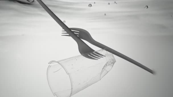 Het wereldwijde milieuprobleem van vervuiling van de oceanen en zeeën met plastic vorken, glazen. — Stockvideo