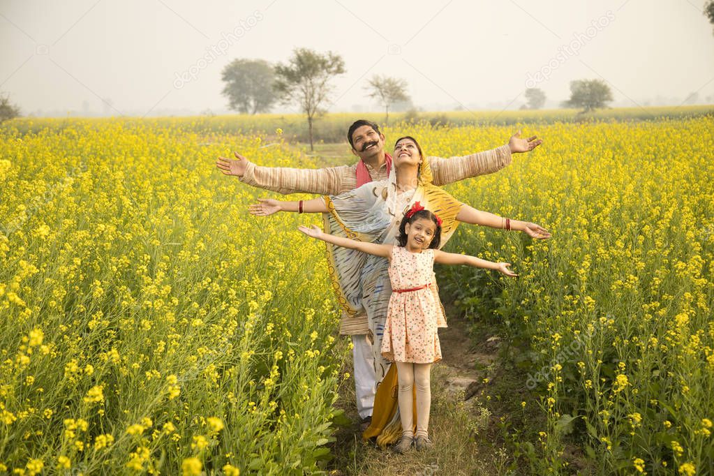 Rural Indian family in agricultural field