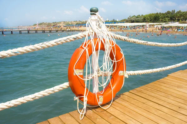 Orange Lifebuoy Pier Sea — Stock Photo, Image