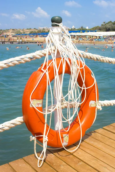 Orange Lifebuoy Pier Sea — Stock Photo, Image