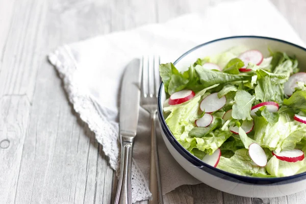 Dietary food for a fitness. Radish, Lettuce and Arugula Salad