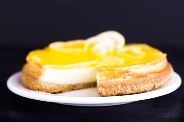 Lemon Cheesecake Black Background Decorated Lemon Zest Close — Stock Photo, Image
