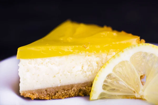 Lemon Cheesecake Black Background Decorated Lemon Zest Close — Stock Photo, Image