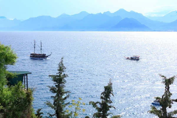 Mediterranean landscape in Antalya. View of the mountains, sea, yachts and the city