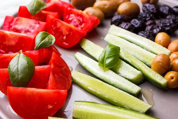 Fresh vegetables tomatoes, cucumber and olives for turkish breakfast — Stock Photo, Image