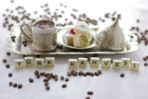Traditional Turkish coffee and sweets in silverware. Lettering - Turkish coffee - in turkish language