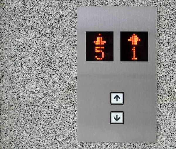 Elevator Button up and down direction with down up light on granite background