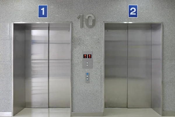 Closed metal elevator doors.