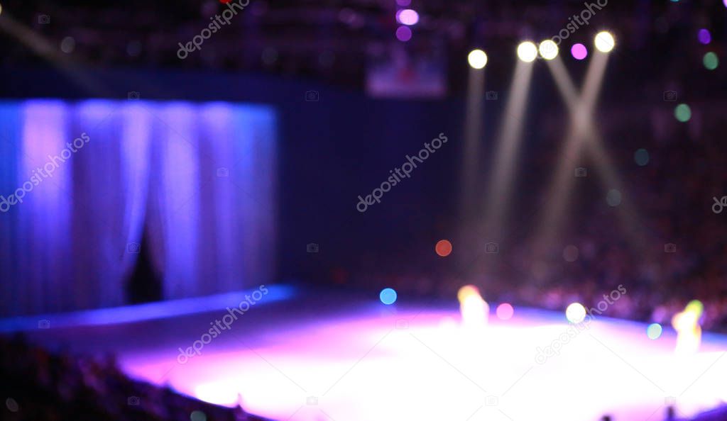 Defocused concert lighting on stage.