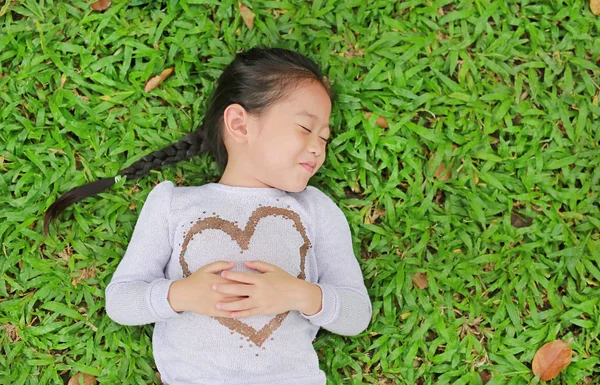 Happy Cute Little Asian Child Girl Lying Green Lawn Smiling — Stock Photo, Image