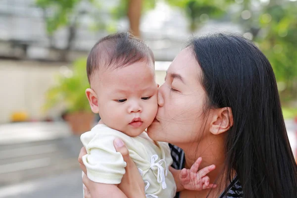 Portrait Asian Mother Carrying Kissing Her Infant Baby Boy Outdoor — Stock Photo, Image