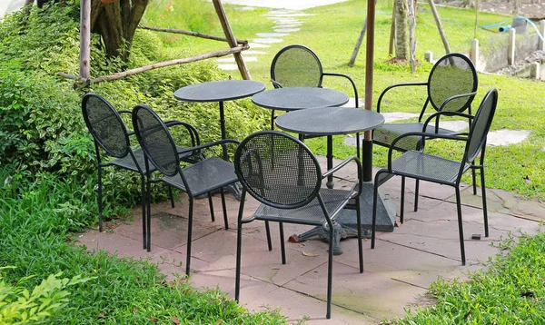 Circle table set with aluminium chair in the garden