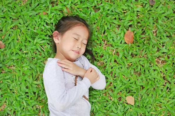 Happy Cute Little Asian Child Girl Lying Green Lawn Smiling — Stock Photo, Image
