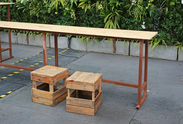 Temporary wood table and stool at street food. Thailand.