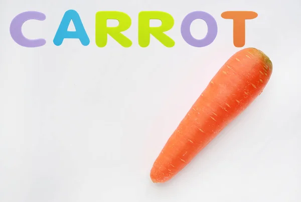 Carrot isolated on the white background with sponge rubber of text \