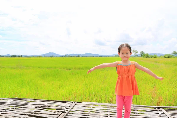 Happy Little Asian Kid Girl Stretch Arms Relaxed Young Green — Stock Photo, Image