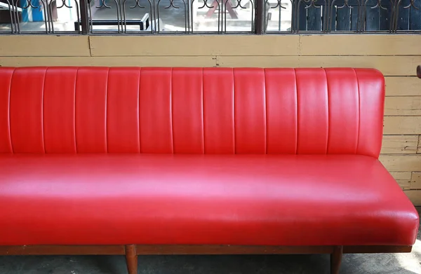 Old style red leather sofa.