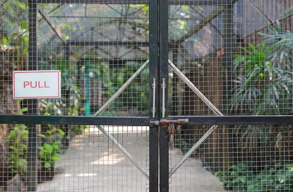 Iron cage door in zoo with \