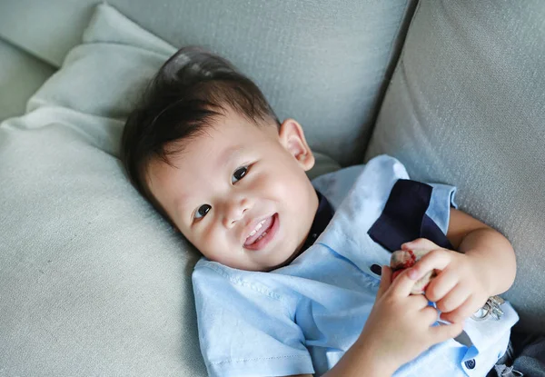 Portrait Happy Little Asian Baby Boy Lying Gray Sofa — Stock Photo, Image