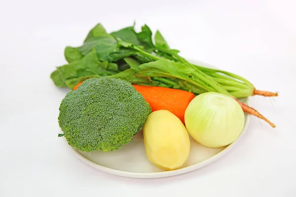 Fresh Vegetable White Plate Onion Carrot Broccoli Potato Spinach — Stock Photo, Image