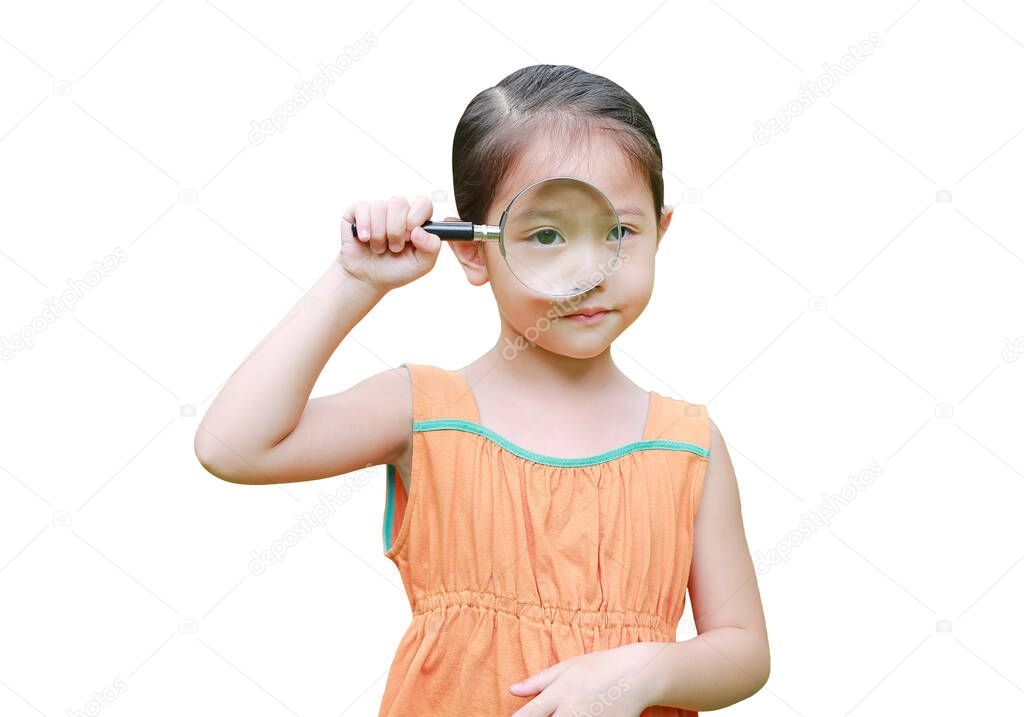 Asian little girl looking through magnifiying glass isolated on white background