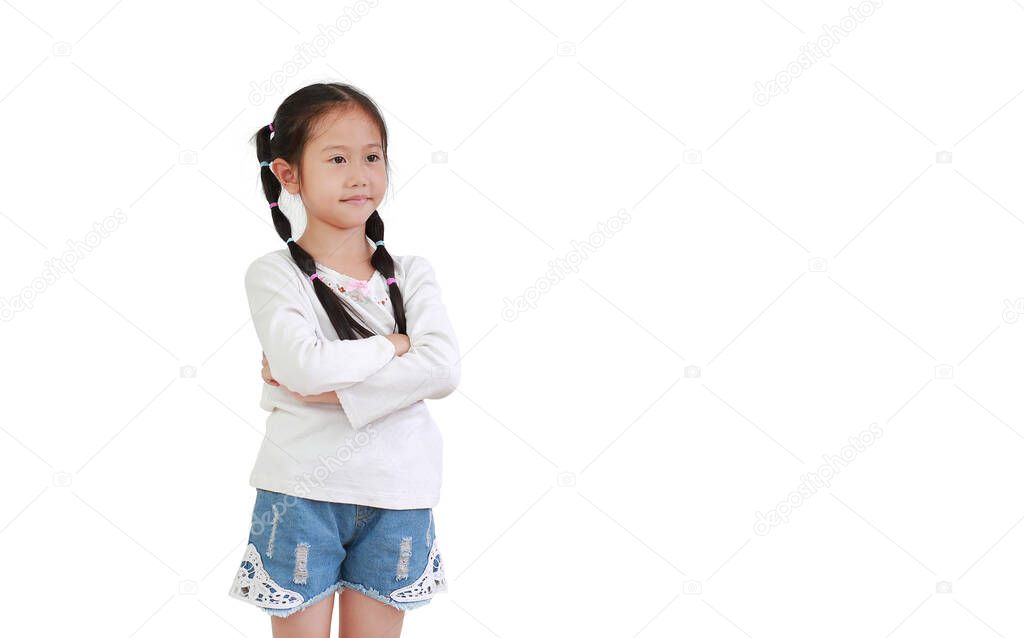 Smart kid girl crossed arms with face smiling looking out isolated on white background with copy space.