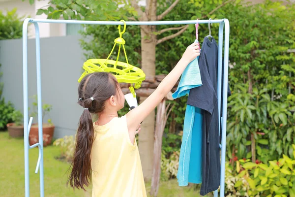 Portrait Asian Little Kid Girl Putting Clothespin Hangs Shirt Dry — Stock Photo, Image