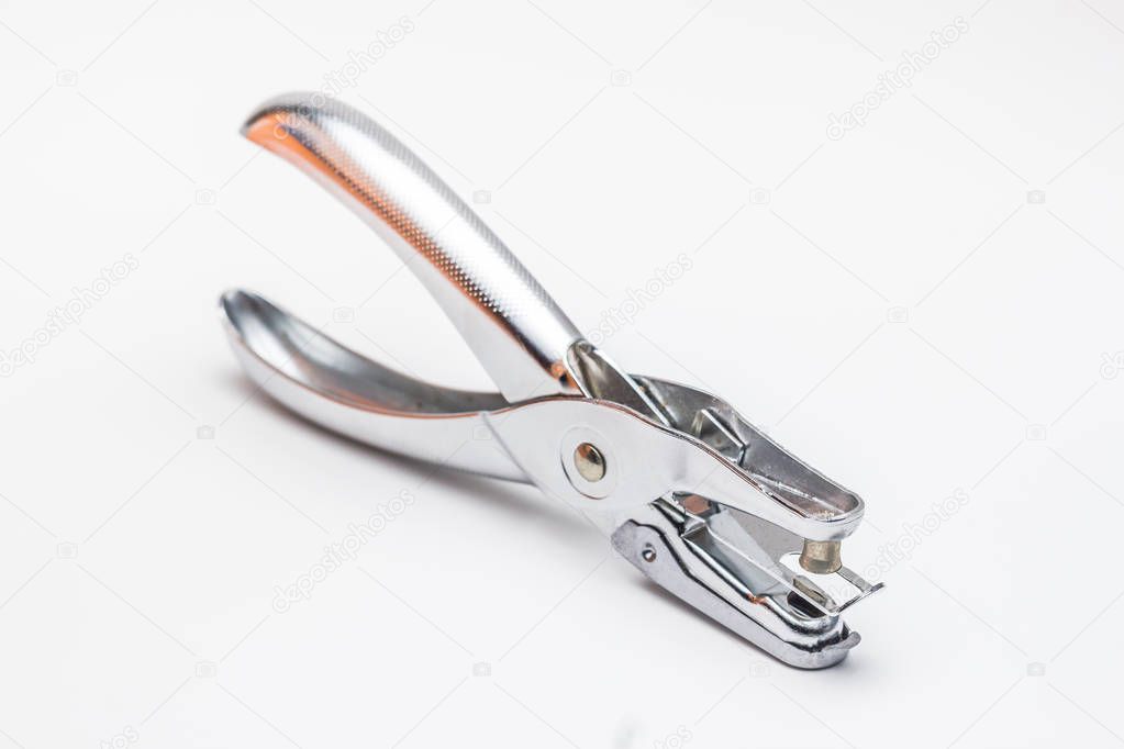 Office hole puncher on white background