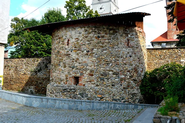 Typical urban landscape in the city Orastie, Transylvania, Romania. A medieval fortified church was built around 1400 in the Gothic style on the foundations of the older Romanesque basilica. A new Lutheran church was built to the north of the town