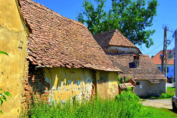 Typical rural landscape and peasant houses in  the village Roades (Radeln), Transylvania, Romania. The settlement was founded by the Saxon colonists in the middle of the 12th century