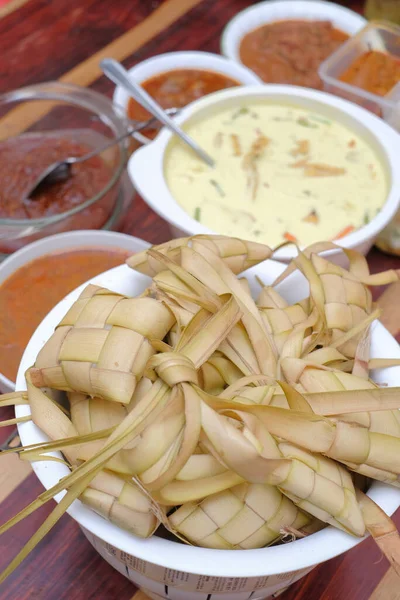 Ketupat, Lodeh and Rendang . Traditional celebratory dish of rice cake with several side dishes, popularly served during Eid celebrations — Stock Image Ketupat Lodeh Rendang Traditional Celebratory Dish Rice Cake Several Side Royalty Free Stock Photos