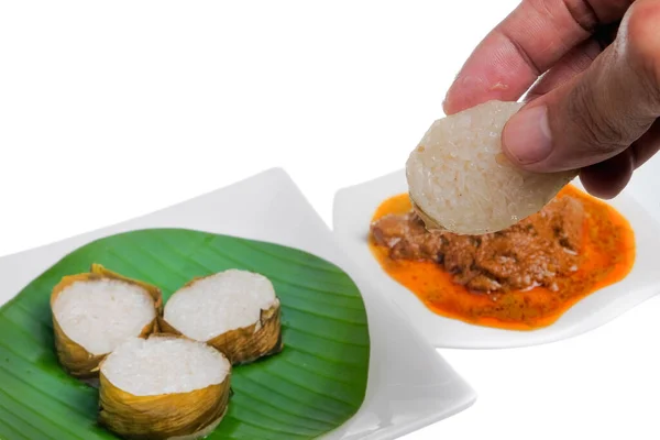 Lemang  and Rendang isolated on white background. Popular food for breaking fast during ramadan, Ramadan Food.