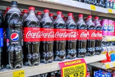 Senawang, Malaysia - March 8th,2020 : Coca Cola Bottles in a Row in a Shop Market  for Sale. clipart