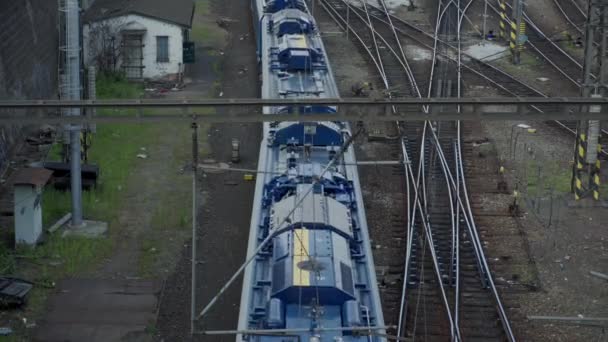 PRAGUE, MAY 16, 2019: top view of the train station, a modern train drives along the train tracks — Stock Video