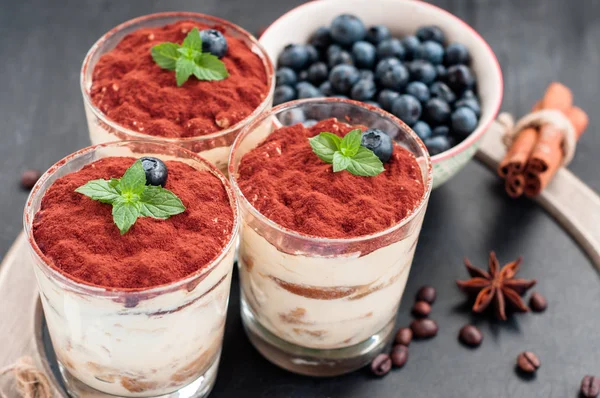 Tiramisu luxury dessert in a glass decorated with mint and berries — Stock Photo, Image